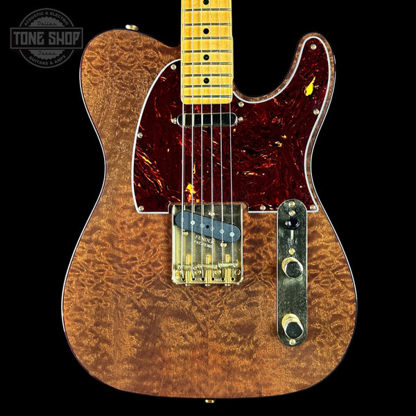 Electric guitar with a marbled finish on a black background, featuring the Tone Shop logo.