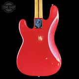 Red electric guitar body with a visible brand logo in the corner.