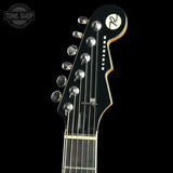 Guitar headstock with 'Reverend' logo on a black background