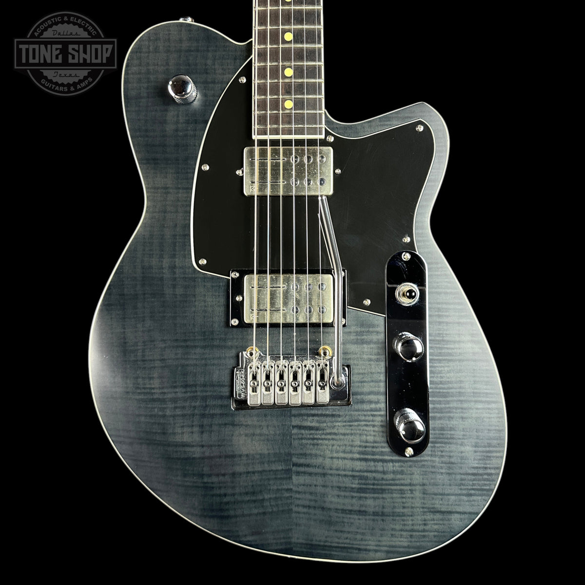 Electric guitar with a black and gray finish on a black background, featuring the Tone Shop logo.
