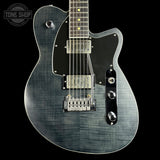 Electric guitar with a black and gray finish on a black background, featuring the Tone Shop logo.
