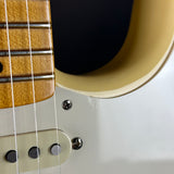 Wear on pickguard of Used 2018 Fender Eric Johnson Thinline Strat Vintage White.