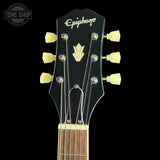 Guitar headstock with Epiphone logo on a black background