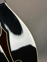 Close-up of a guitar's soundhole with a blurred background