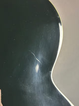 Scratched black surface with a white border