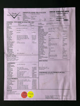 Document with text and a red sticker on a black background
