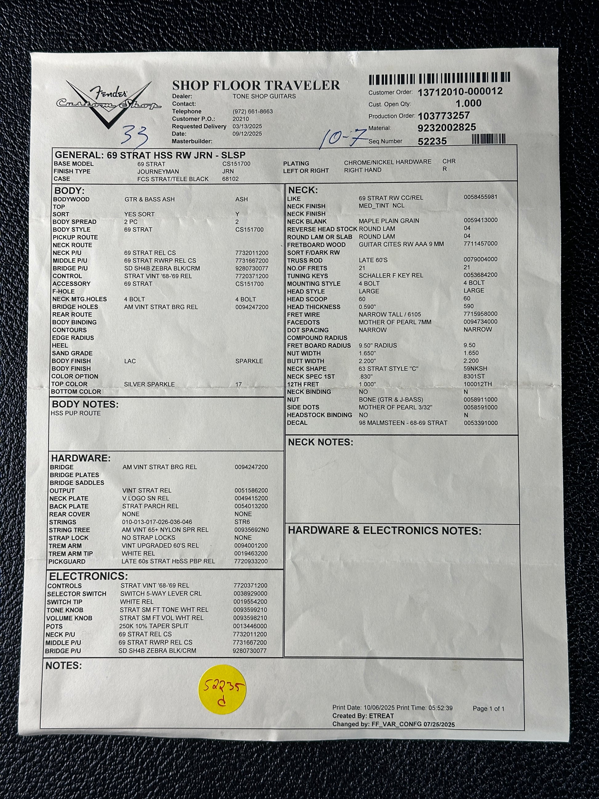 Document with text and a yellow sticker on a black background