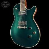 Teal electric guitar on a black background with 'Tone Shop' logo.
