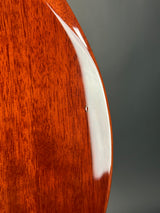 Close-up of a wooden surface with a white stripe on a dark background
