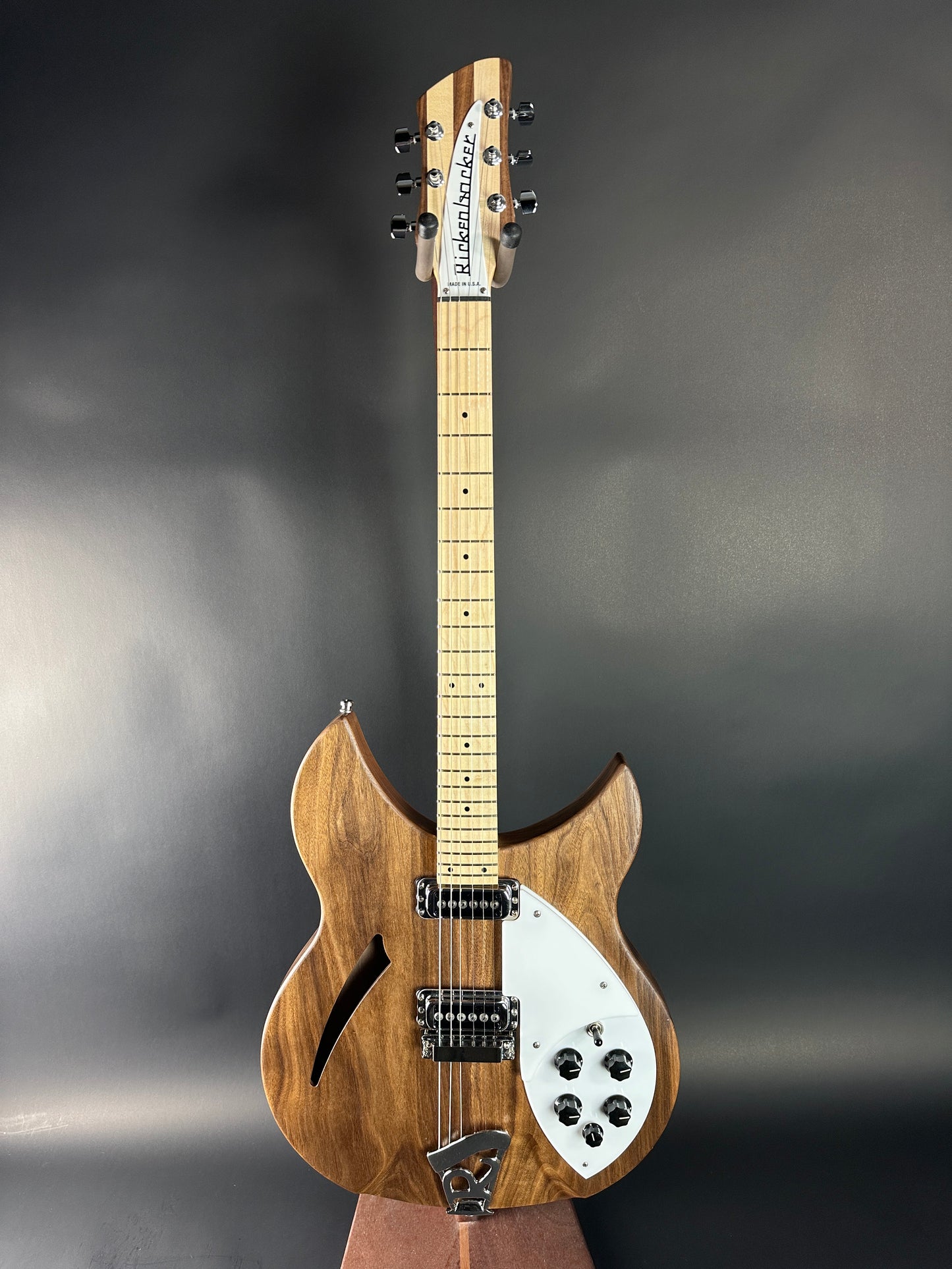 Wooden electric guitar on a dark gray background