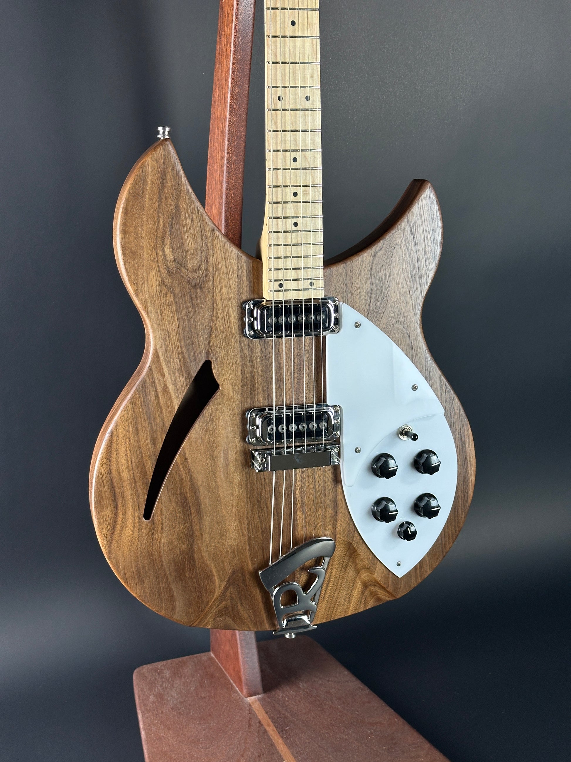 Wooden electric guitar with a dark background
