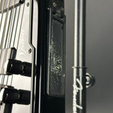 Close-up of a guitar's headstock with tuning pegs and brand name.