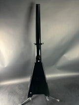 Black metal tool on a reflective metallic surface