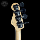 Guitar headstock with tuning pegs on a black background, featuring 'Tone Shop' logo.