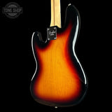 Electric guitar with a sunburst finish on a black background, featuring the Fender logo.