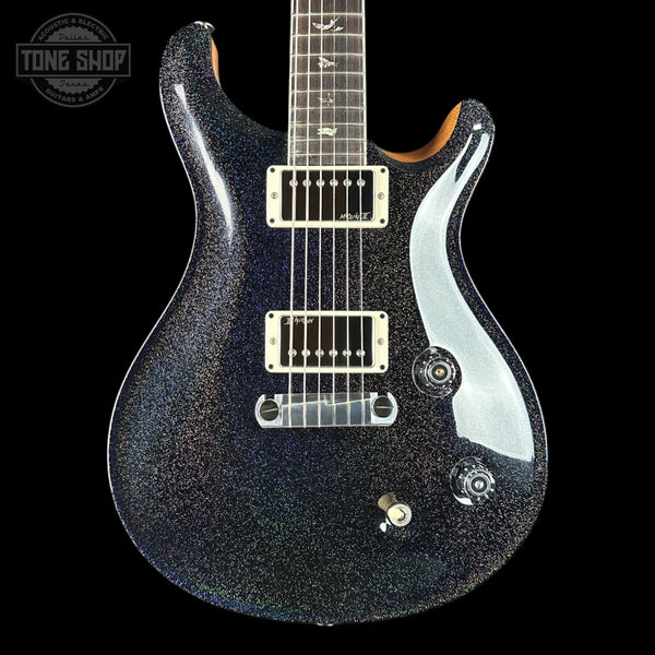 Black electric guitar with a glossy finish on a black background, featuring the 'Tone Shop' logo.