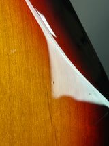 Close-up of a white triangle on a textured brown surface