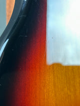 Close-up of a car's side mirror with a blurred background