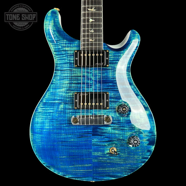 Blue electric guitar with a black background