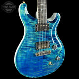 Blue electric guitar with a black background
