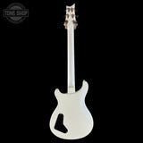 White electric guitar on a black background with 'Tone Shop' logo.