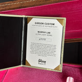 Gibson Custom Certificate of Authenticity on a red background