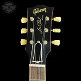 Gibson Les Paul guitar headstock on a black background
