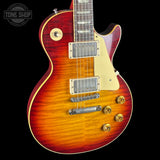Electric guitar with a sunburst finish on a black background, featuring the Tone Shop logo.