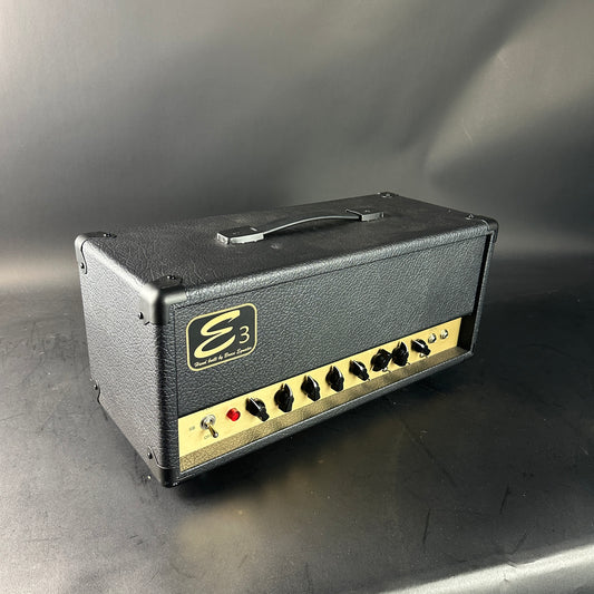 Guitar amplifier head with 'E3' logo on a gray background