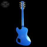 Blue electric guitar on a black background with 'Tone Shop' logo.