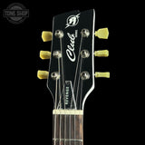 Guitar headstock with 'Revenge' branding on a black background