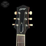Guitar headstock with 'Collings' branding on a black background