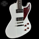 White electric guitar with a red pickguard on a black background, featuring 'Tone Shop' branding.