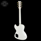 White electric guitar on a black background with 'Tone Shop' logo.