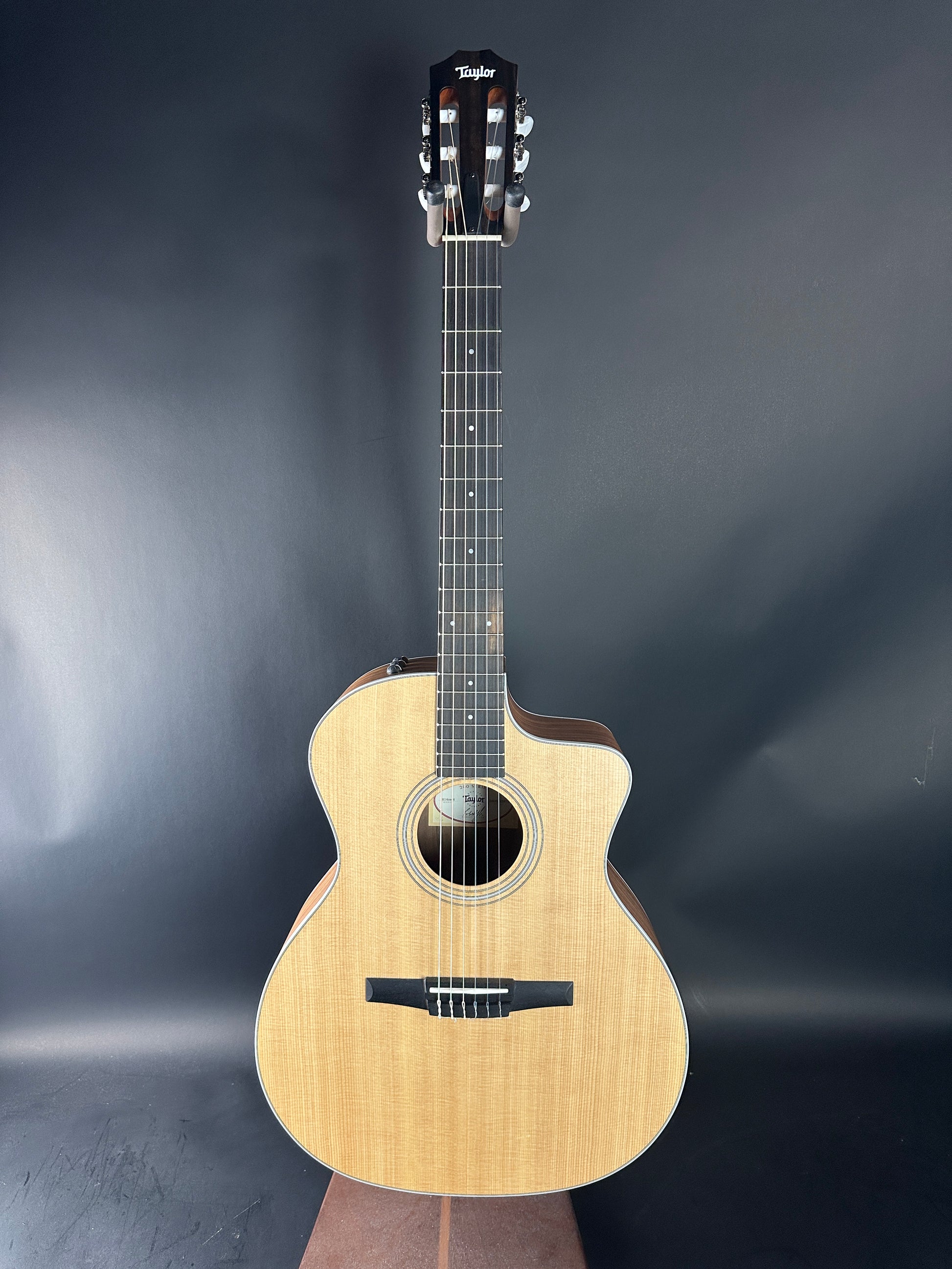 Acoustic guitar on a dark gray background