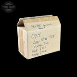 A vintage cardboard box with handwritten notes on a solid black background. The box is made of light brown corrugated cardboard and features handwritten text identifying it as a 'Sta.