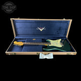 Fender electric guitar in a blue case with 'Tone Shop' logo.