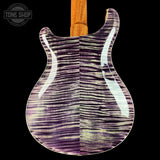 Guitar body with purple and white pattern on a black background