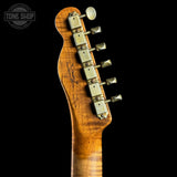 Close-up of a guitar neck with tuning pegs on a black background, featuring the Tone Shop logo.