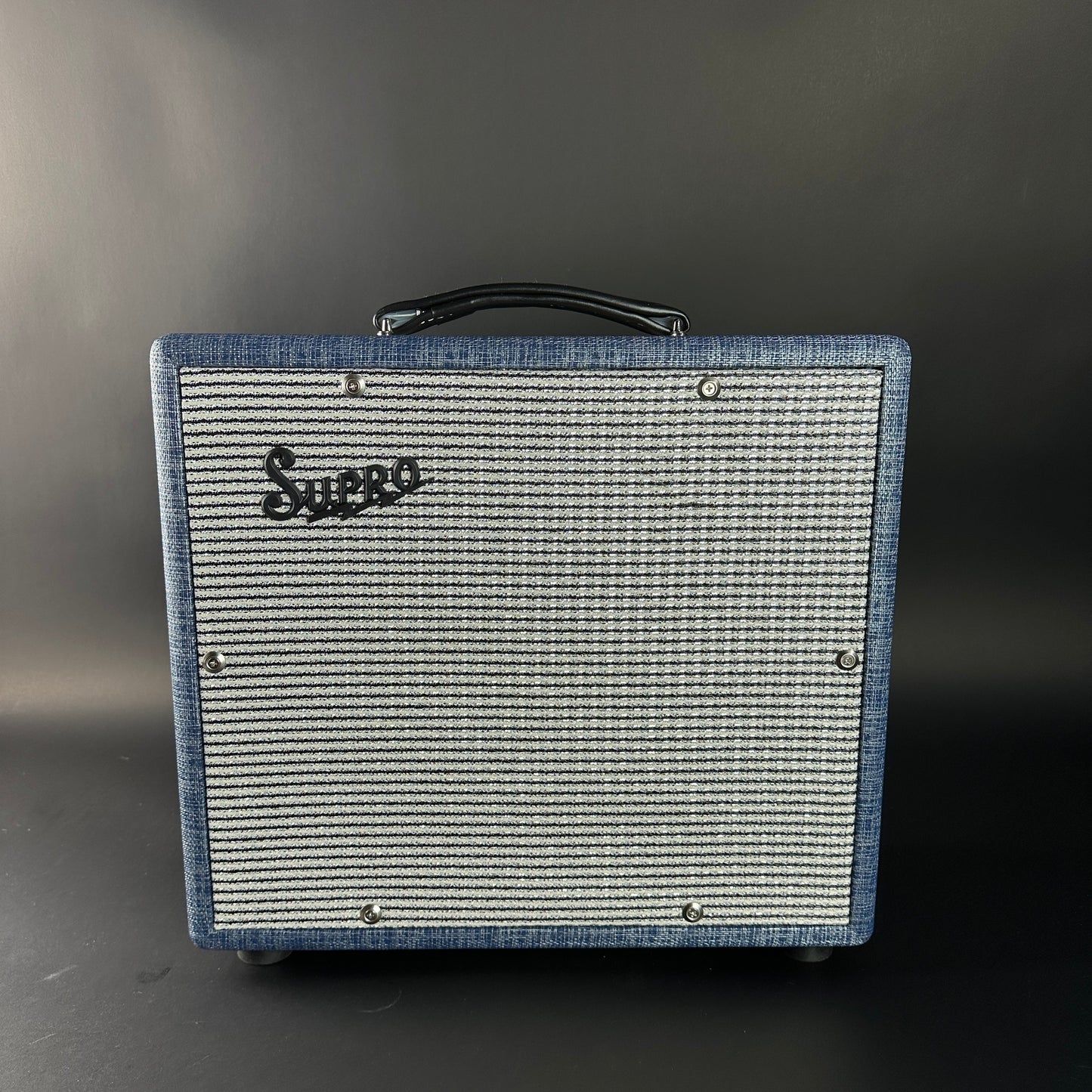 Vintage-style guitar amplifier with 'Suhr' branding on a dark background