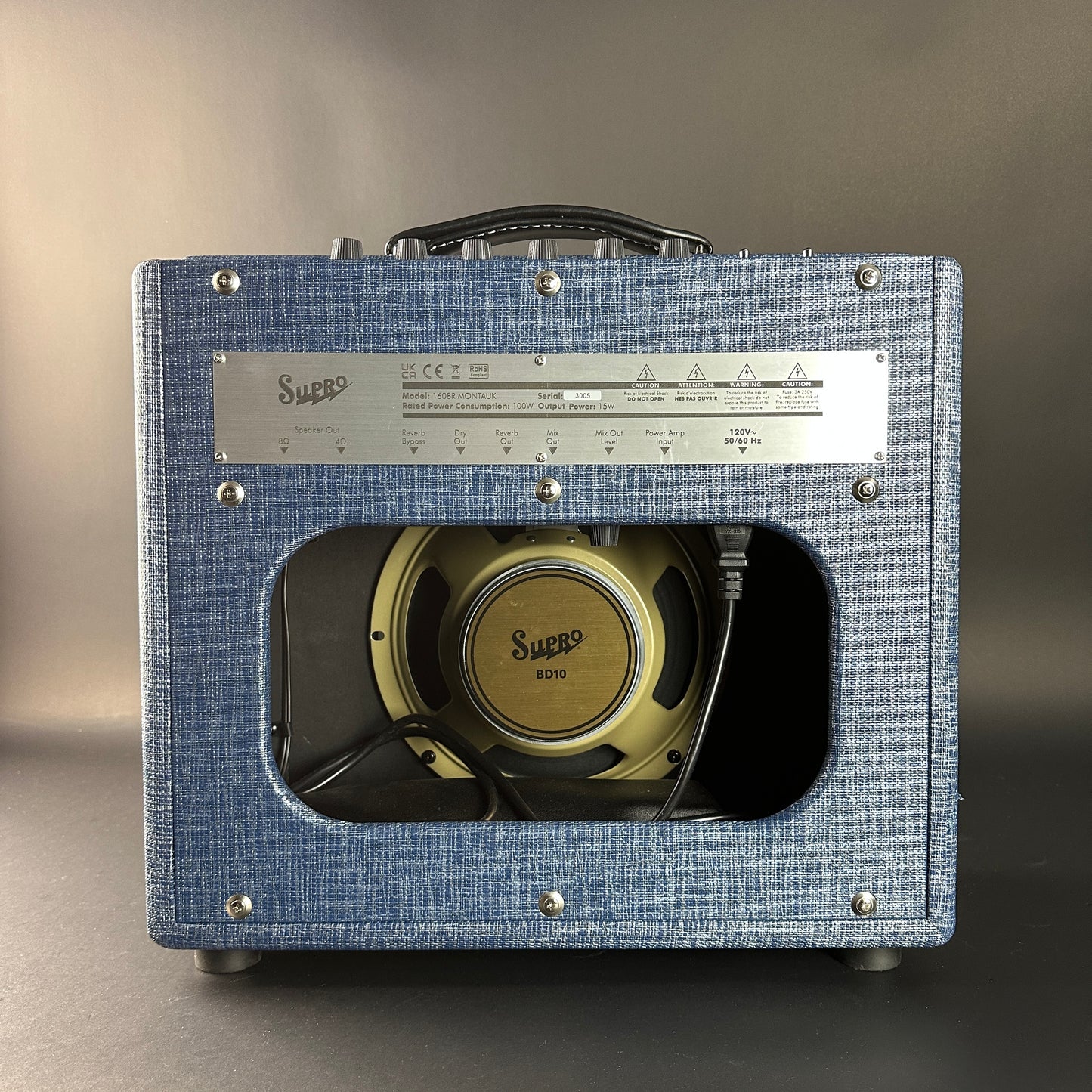 Blue guitar amplifier with visible brand name on a gray background