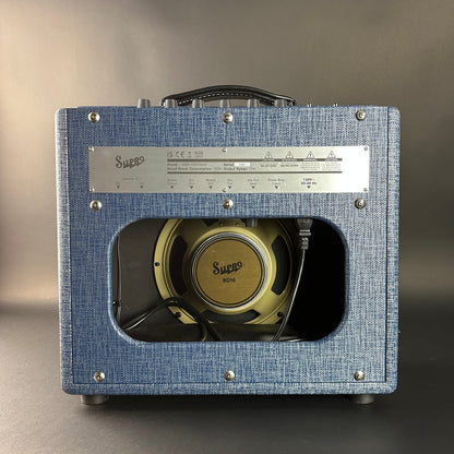 Blue guitar amplifier with visible brand name on a gray background