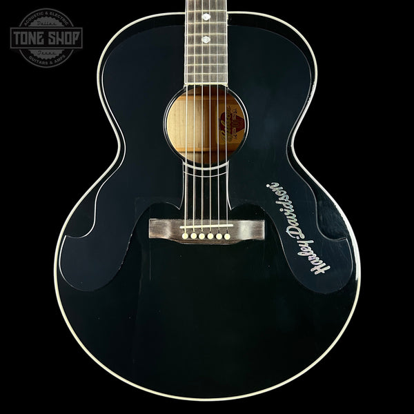 Acoustic guitar with 'Heritage' branding on a black background