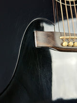 Close-up of a guitar's soundhole and strings