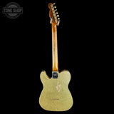 Gold glitter electric guitar with a black background, featuring the Tone Shop logo.