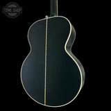 Back view of a black acoustic guitar with a visible brand logo in the corner.