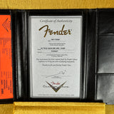 Fender certificate of authenticity with branding on a gold and black background