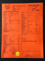 Orange paper with text and a yellow label on a black background