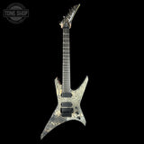 Electric guitar with a unique design on a black background, featuring the brand 'Tone Shop'.