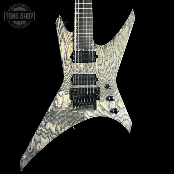 Electric guitar with a unique pattern on a black background, featuring the 'Tone Shop' logo.